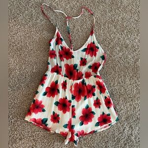 Super cute open back floral romper